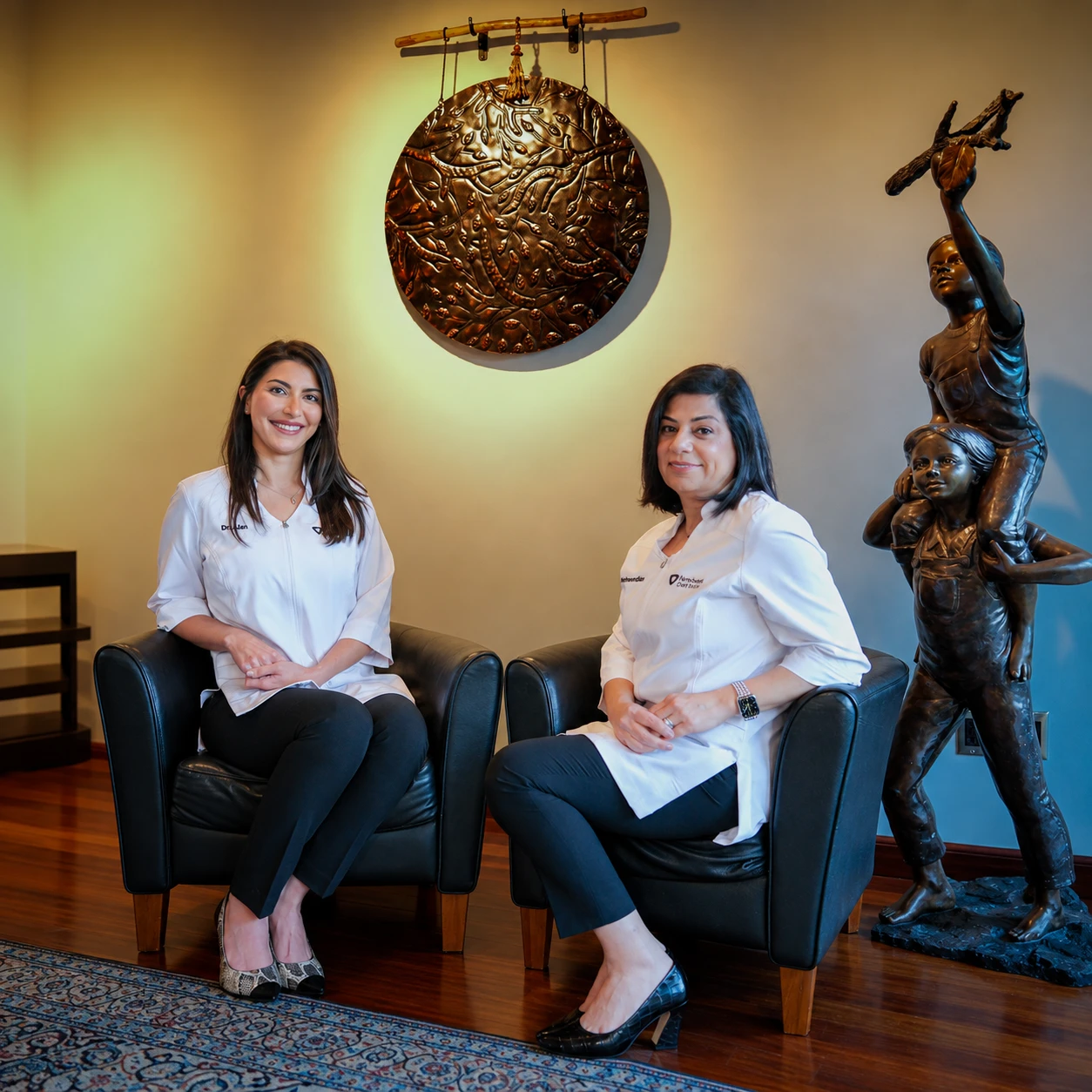 Dr. Rana Alan and Dr. Nancy Nehawandian seated in the Top Down Dental office